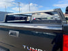 Close-up rear angled view of black Toyota Tundra with Overland Bed Rack - Cali Raised LED