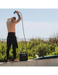 RinseKit Cube portable outdoor shower used after surfing near the beach
