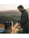 RinseKit Cube portable shower used for hand washing at outdoor campsite