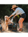 RinseKit Cube portable shower washing dog during outdoor adventure