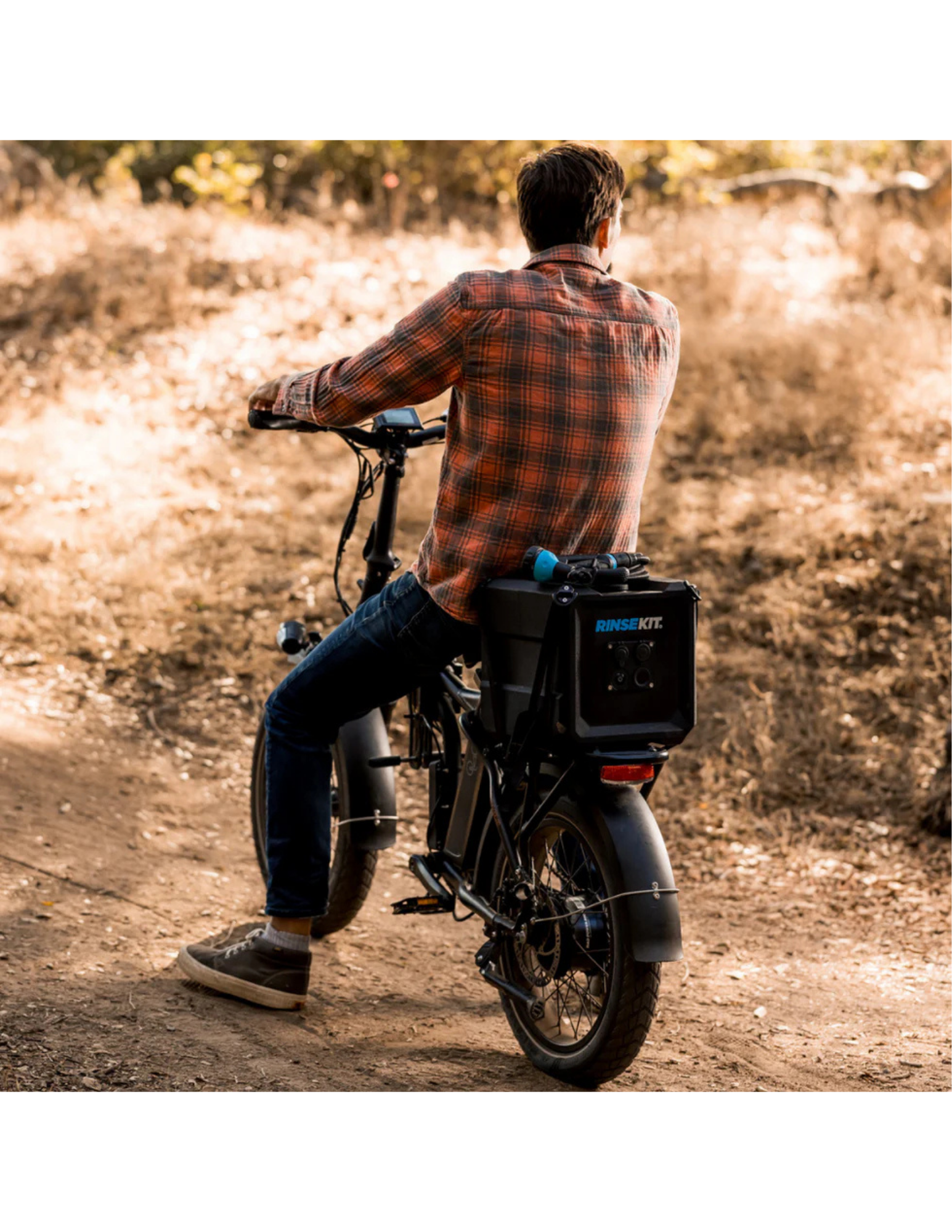 RinseKit Cube mounted on electric bike for portable water access on trails
