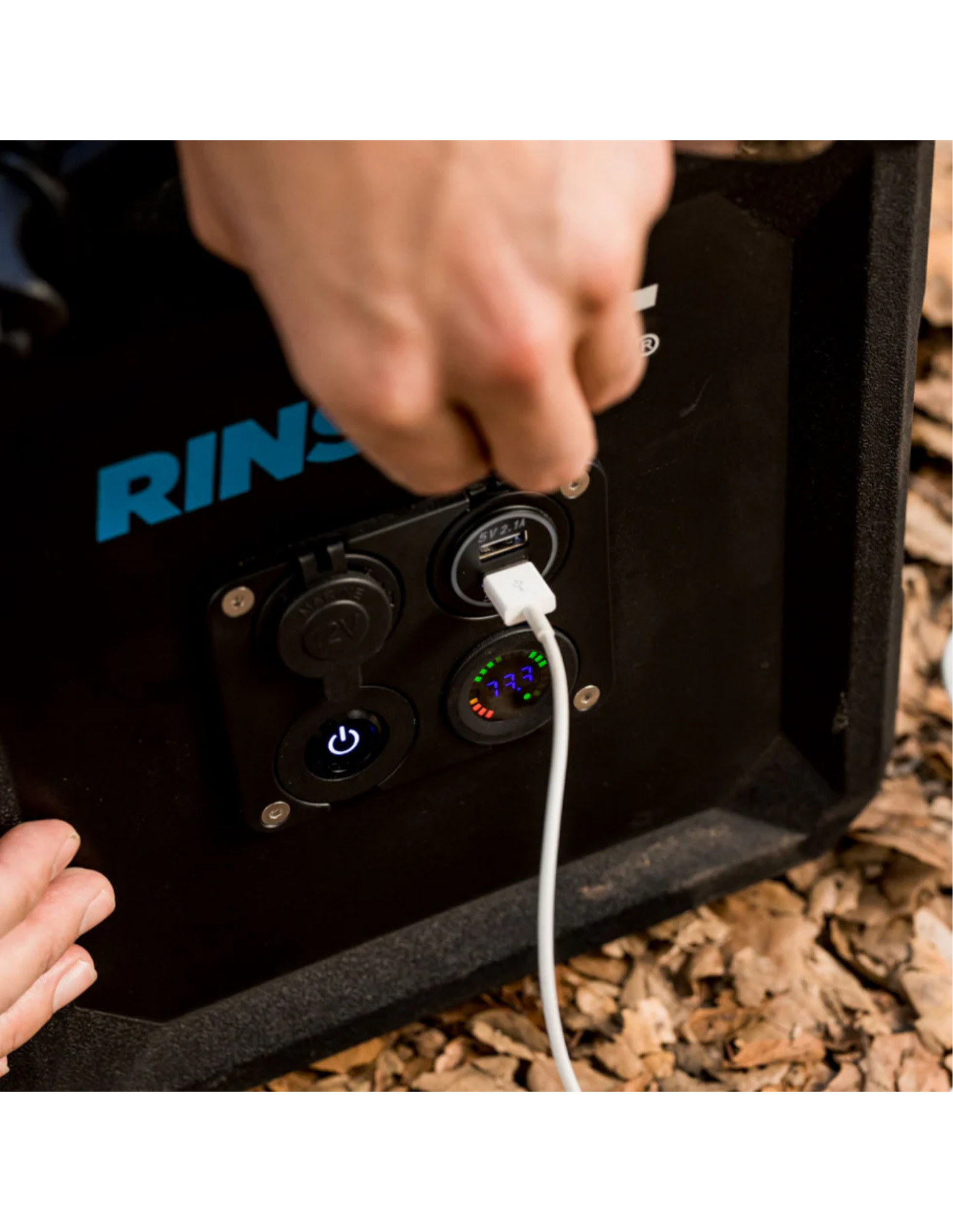 RinseKit Cube control panel with USB charging port and battery gauge close-up
