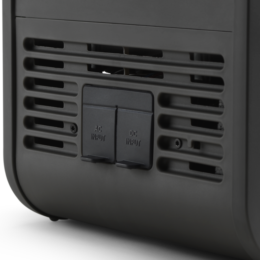 Black fridged with AC and DC input ports on a white background