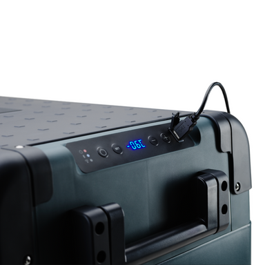 Green suitcase with digital display and power cable on a white background