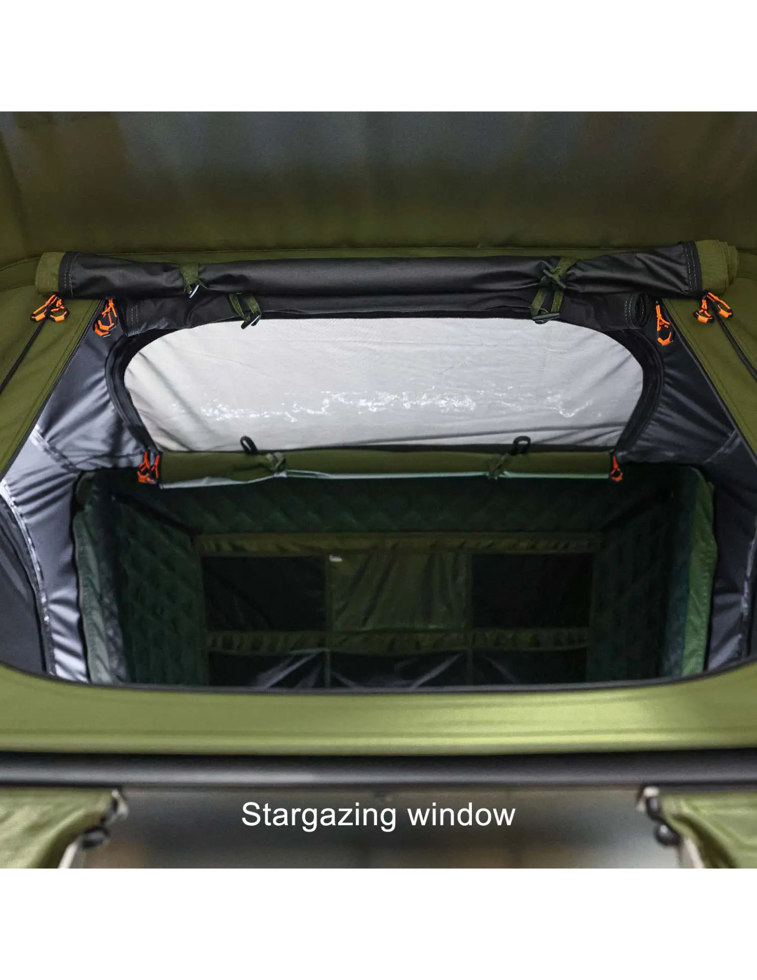 Stargazing window in a green roof top tent 