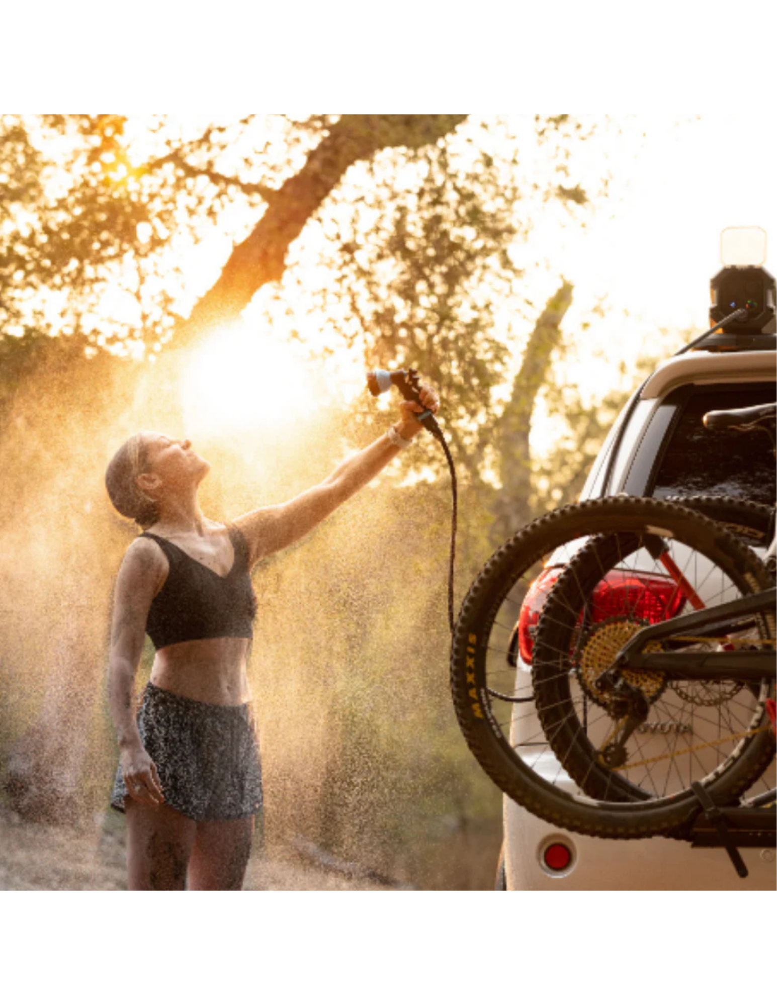 RinseKit rack shower used as portable outdoor shower after biking and camping