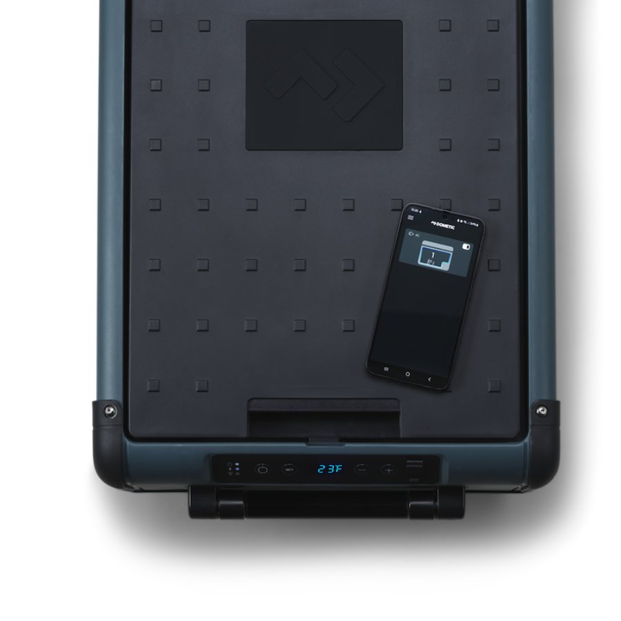 Black portable cooler with digital display and smartphone on a white background