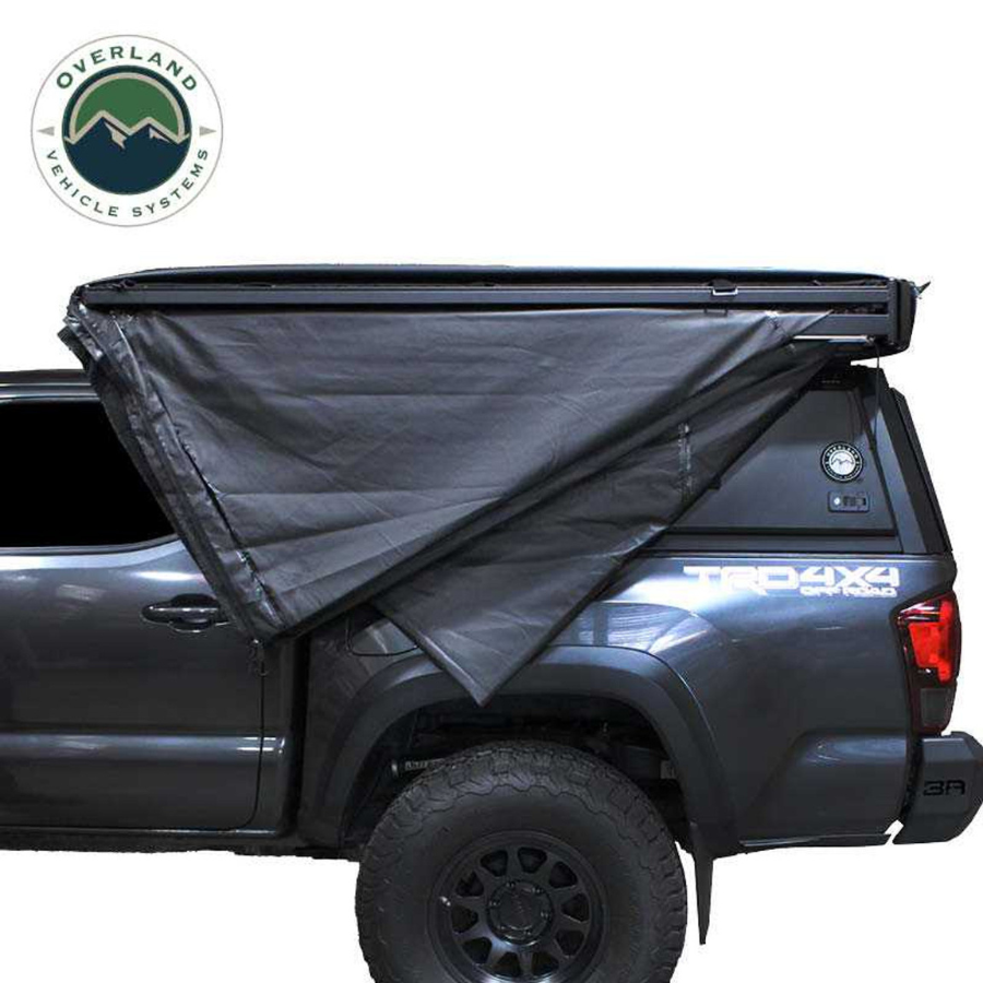 OVS XD Nomadic 270 Degree Awning W/Lights & Black Out - Black Body, Grey Trim & Black Travel Cover folded closed 