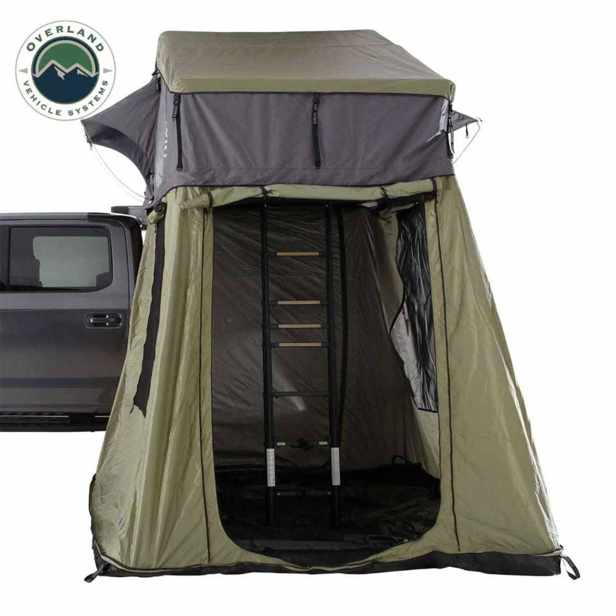 OVS HD Nomadic 4 Roof Top Tent Annex Green Base With Black Floor & Travel Cover front view with door rolled open 