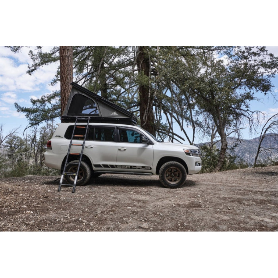 Tuff Stuff Overland Alpine 61 Hardshell Rooftop Tent, Aluminum, 2-3 Person, Black half opened side view outdoor