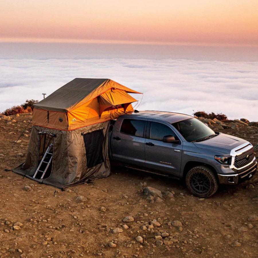 Tuff Stuff Overland Ranger 65 Rooftop Tent, 3 Person, Tan top right view on mountain in clouds