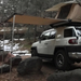 Tuff Stuff Overland Truck or Car Awning, 4.5x6 Feet, Poly-Cotton Ripstop Fabric, Tan left view with roof top tent