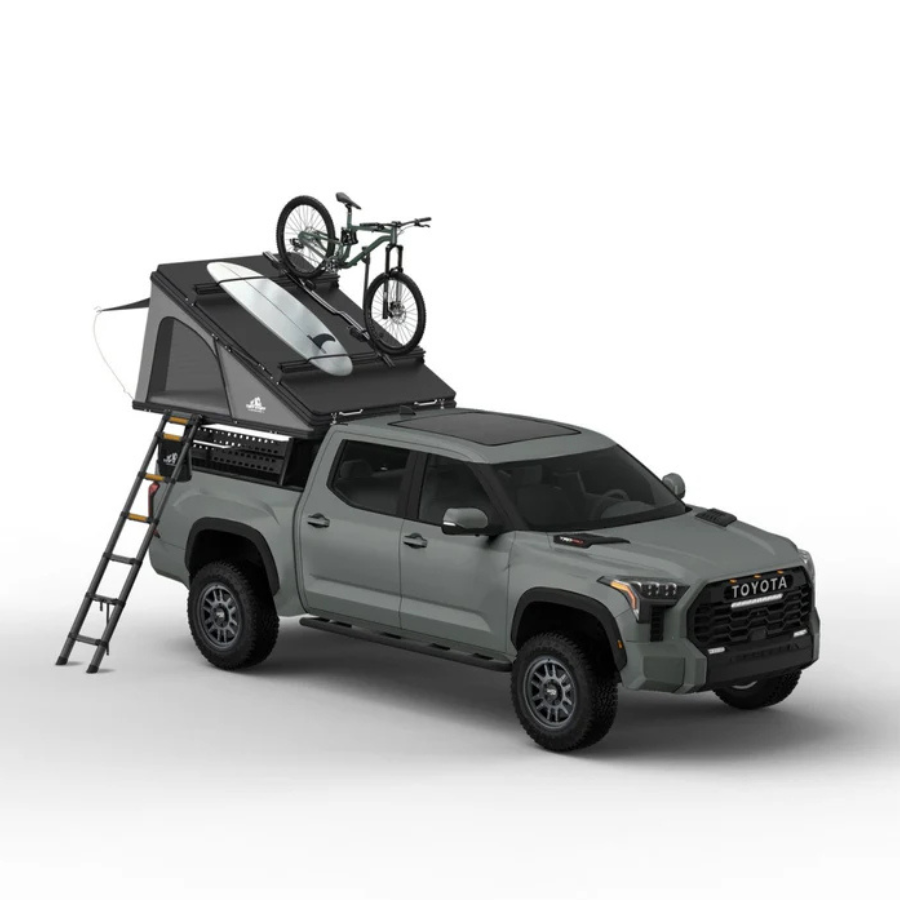 Tuff Stuff Overland Alpine 61 Hardshell Rooftop Tent, Aluminum, 2-3 Person, Black halfway open with bike and surfboard mounted