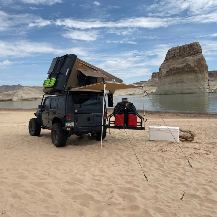 TUFF STUFF OVERLAND  STEALTH HARDSHELL ROOFTOP TENT, ALUMINUM, 3 PERSON, BLACK  rear sided view with awning out