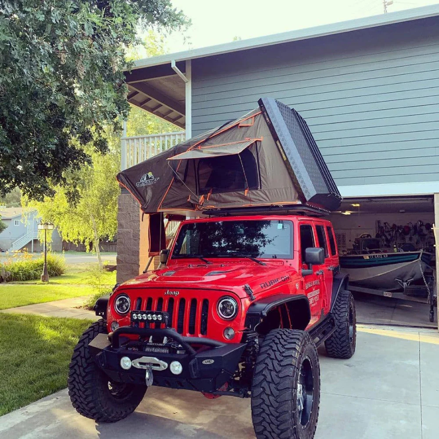 TUFF STUFF OVERLAND  STEALTH HARDSHELL ROOFTOP TENT, ALUMINUM, 3 PERSON, BLACK side view on jeep