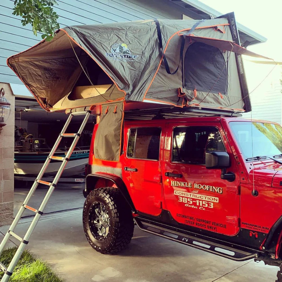 TUFF STUFF OVERLAND  STEALTH HARDSHELL ROOFTOP TENT, ALUMINUM, 3 PERSON, BLACK front corner view on jeep