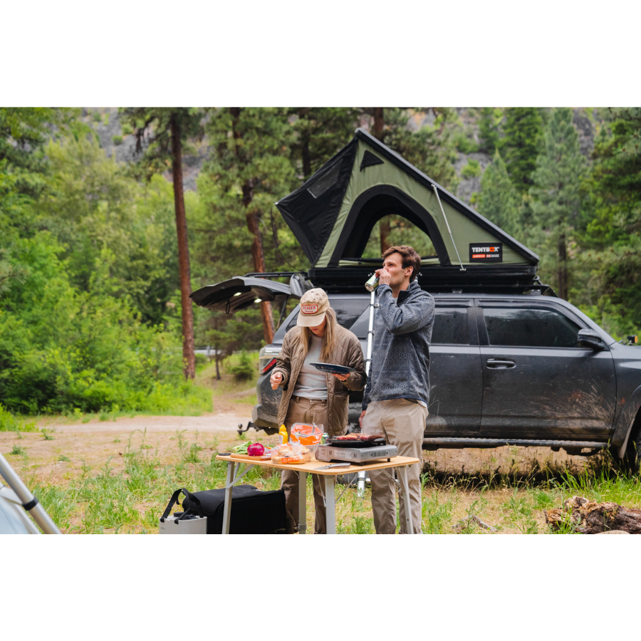 TentBox Cargo 2.0 Rooftop Tent in background of people camping