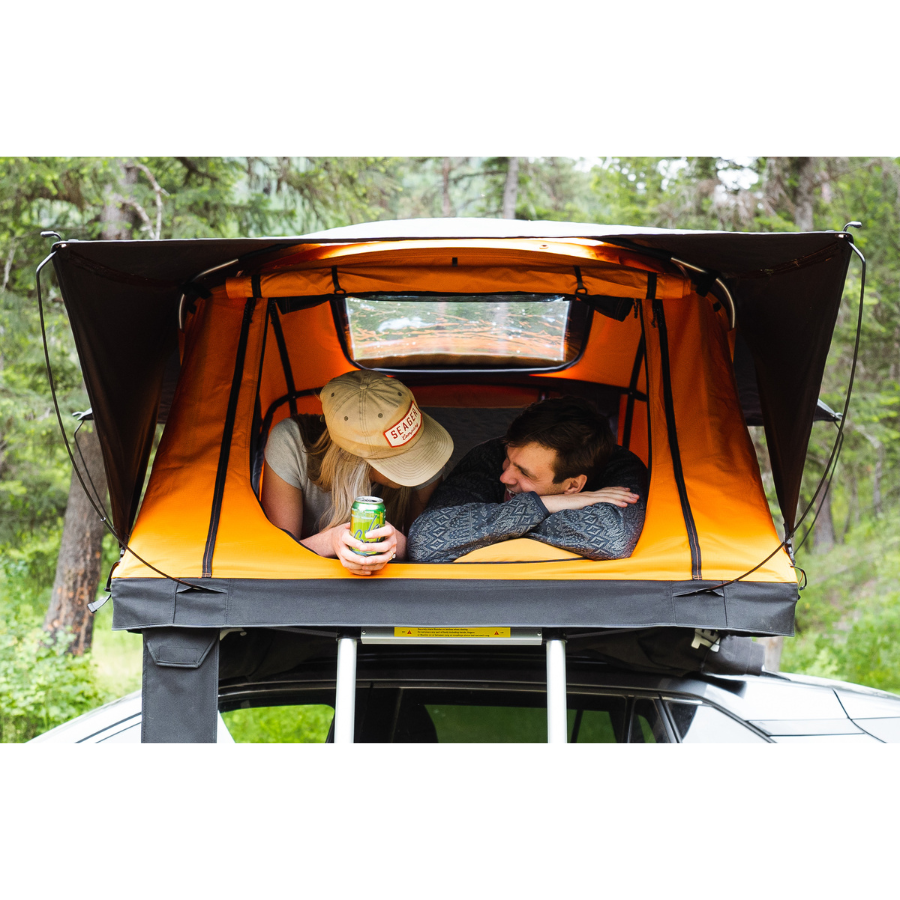 TentBox Lite 2.0 Rooftop Tent front view with two people inside